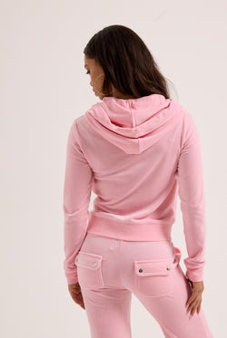 Displays a model wearing the Pink Classic 'Juicy' branded Velour Robertson Hoodie 