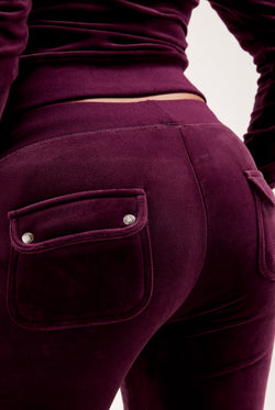 Displays the Wine-tasting classic 'juicy' branded velour del ray pocketed 