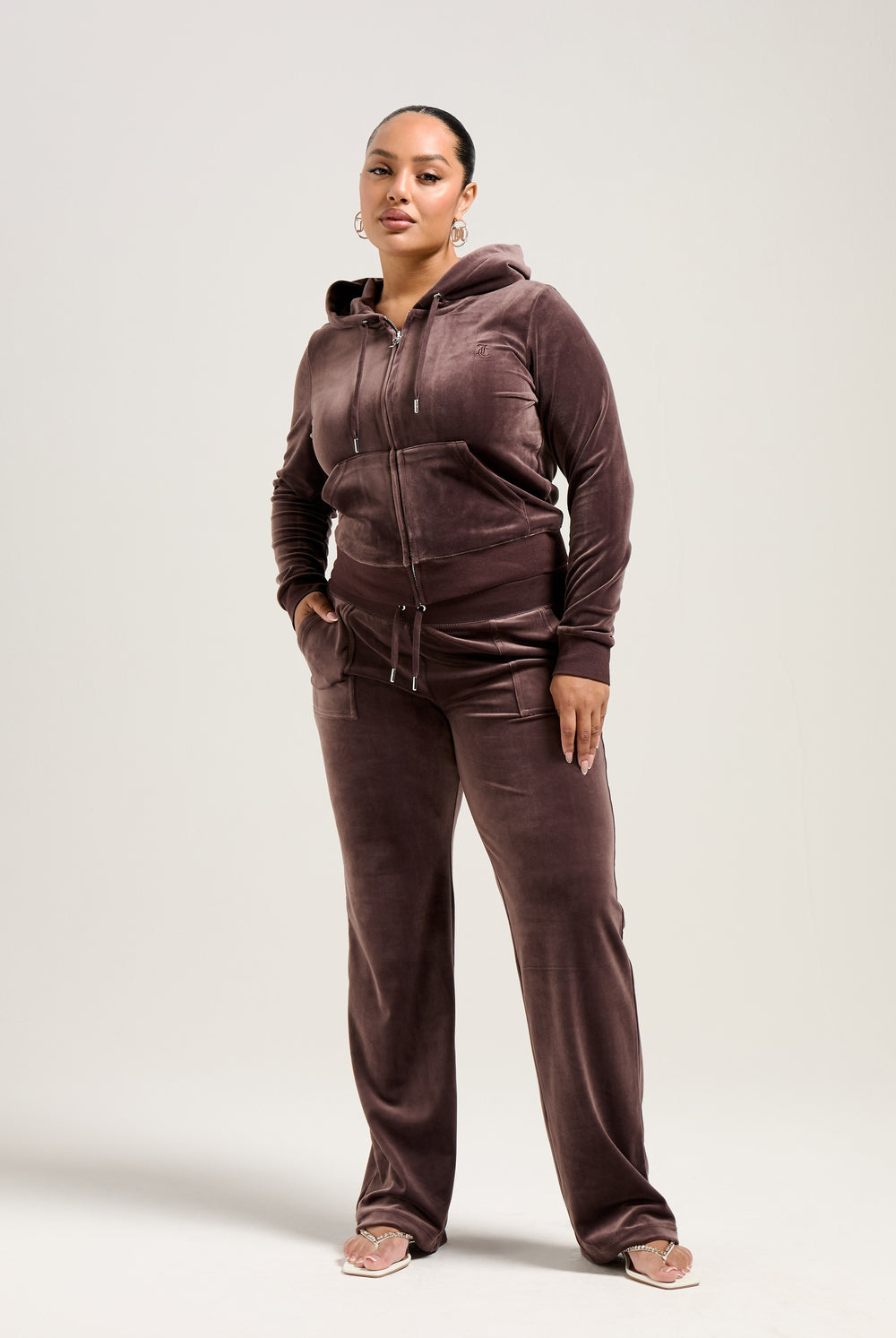 Displays a model wearing the Java 'Juicy' branded classic velour Robertson hoodie 