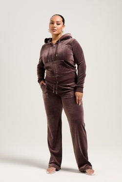 Displays a model wearing the Java 'Juicy' branded classic velour Robertson hoodie 
