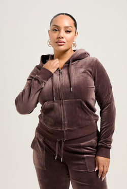 Displays a model wearing the Java 'Juicy' branded classic velour Robertson hoodie 