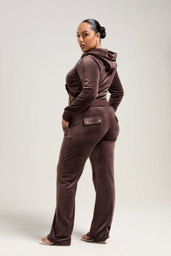 Displays a model wearing the Java 'Juicy' branded classic velour Robertson hoodie 