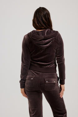 Displays a model wearing the Java 'Juicy' branded classic velour Robertson hoodie 