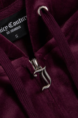Displays the wine tasting classic 'juicy' branded velour Robertson hoodie featuring the juicy zip 