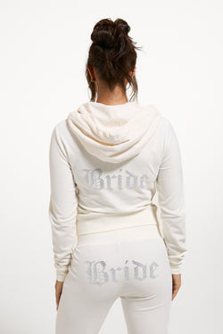 Displays a model wearing the 'Juicy' branded Bridal classic velour hoodie  
