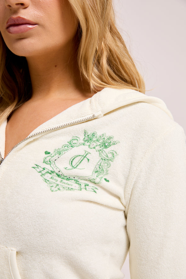 Displays a model wearing the Marshmallow Towelling 'Juicy' branded chateau hoodie
