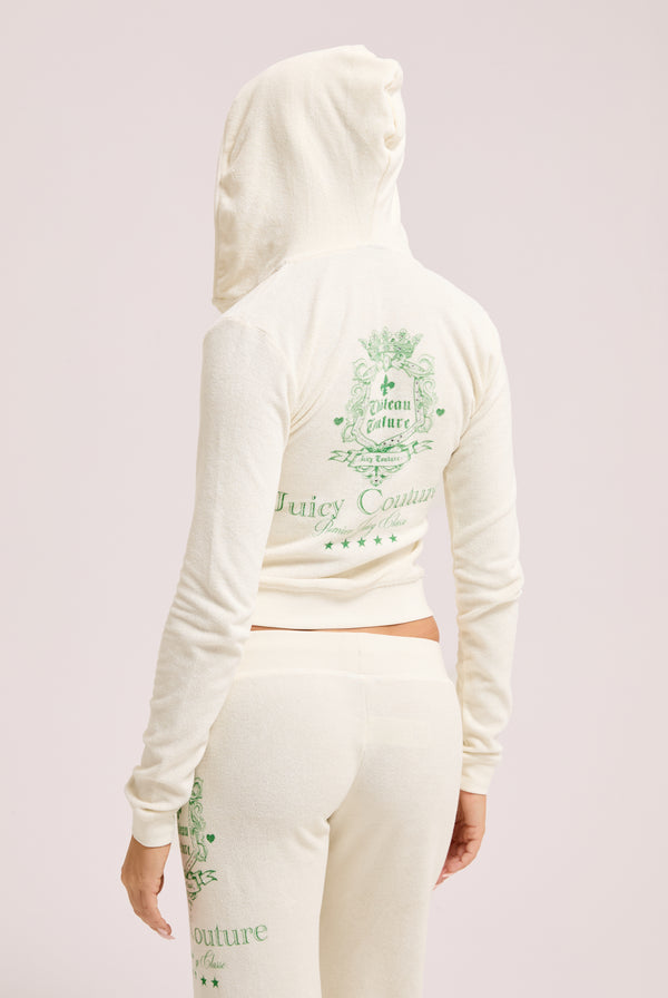 Displays a model wearing the Marshmallow Towelling 'Juicy' branded chateau hoodie and bottoms 