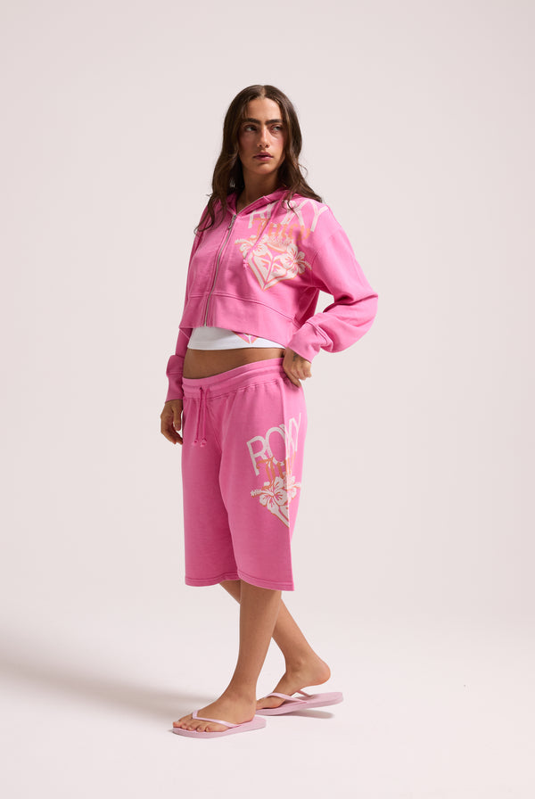 Displays a model wearing the Pink Azalea Roxy & Juicy Couture relaxed jorts 