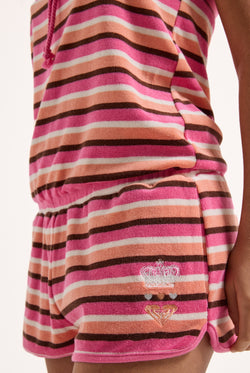 Displays a model wearing the stripe Roxy & Juicy couture Terry towelling romper 