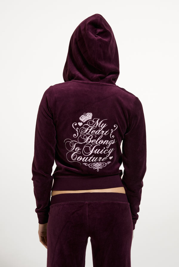 Displays a model wearing the Winetasting 'Juicy' branded Script Rebelle Robyn Hoodie