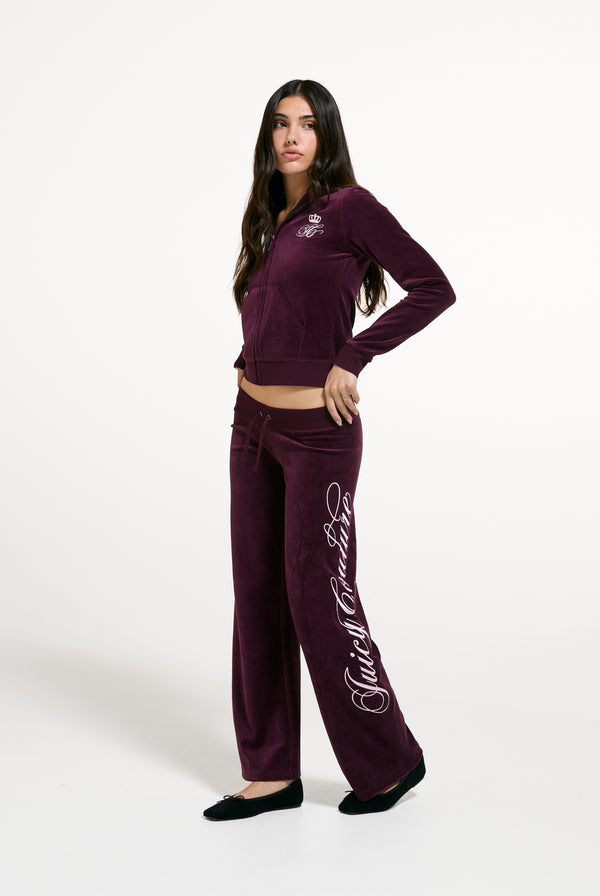 Displays a model wearing the Winetasting 'Juicy' branded Script Rebelle Robyn Hoodie