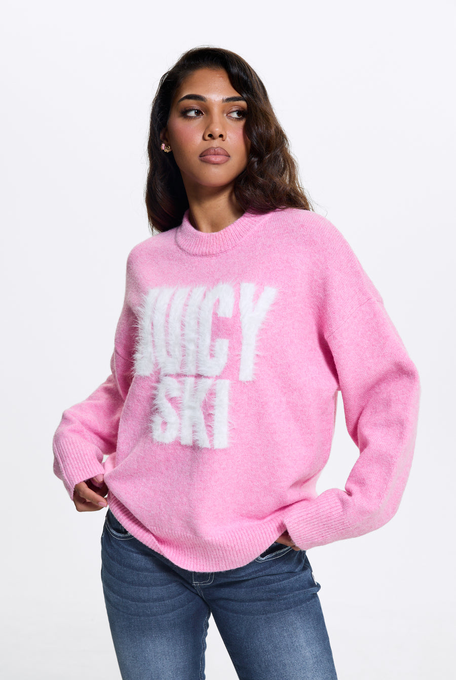 Displays a model wearing the Begonia Pink 'Juicy' branded Juicy Ski Knit Jumper