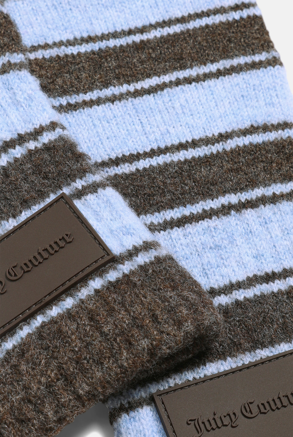 Displays the Java Stripe 'Juicy' branded Fingerless Mittens featuring the details on the juicy branding 