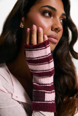 Displays a model wearing the Burgundy Stripe 'Juicy' branded Fingerless Mittens