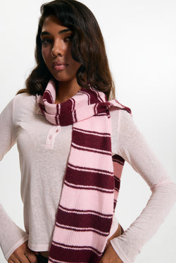Displays a model wearing the Burgundy 'juicy' branded Stripe Knit Scarf
