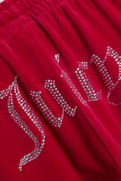 Displays the Persian Red 'Juicy' branded Velour Diamanté Tracksuit Bottom featuring the juicy branding 