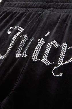 Displays the Black 'Juicy' branded velour tracksuit bottoms featuring the juicy branding 