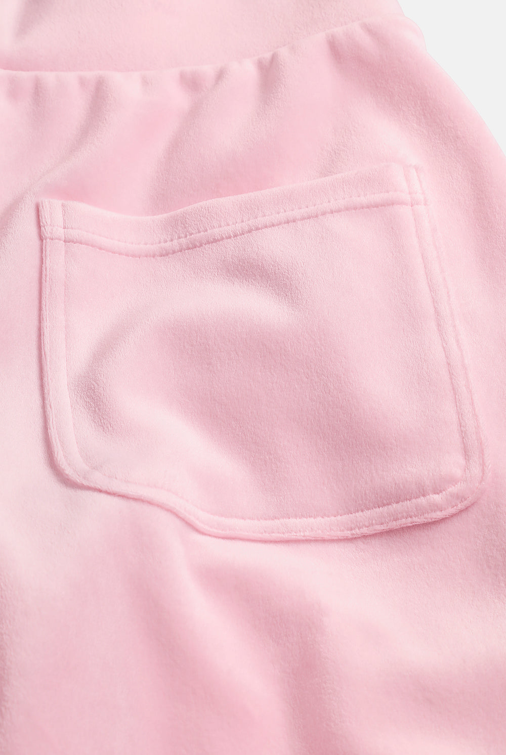 Displays the Cherry Blossom 'Juicy' branded Velour Bonded Tracksuit Bottom featuring the details on the pockets 