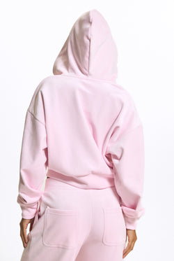 Displays a model wearing the Cherry Blossom 'Juicy' branded Velour Bonded Hoodie