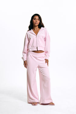 Displays a model wearing the Cherry Blossom 'Juicy' branded Velour Bonded Tracksuit Bottom