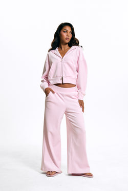 Displays a model wearing the Cherry Blossom 'Juicy' branded Velour Bonded Tracksuit Bottom