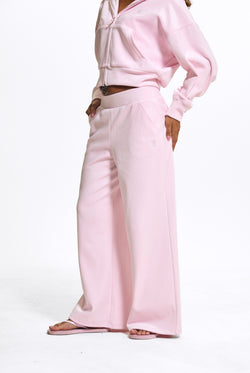 Displays a model wearing the Cherry Blossom 'Juicy' branded Velour Bonded Tracksuit Bottom
