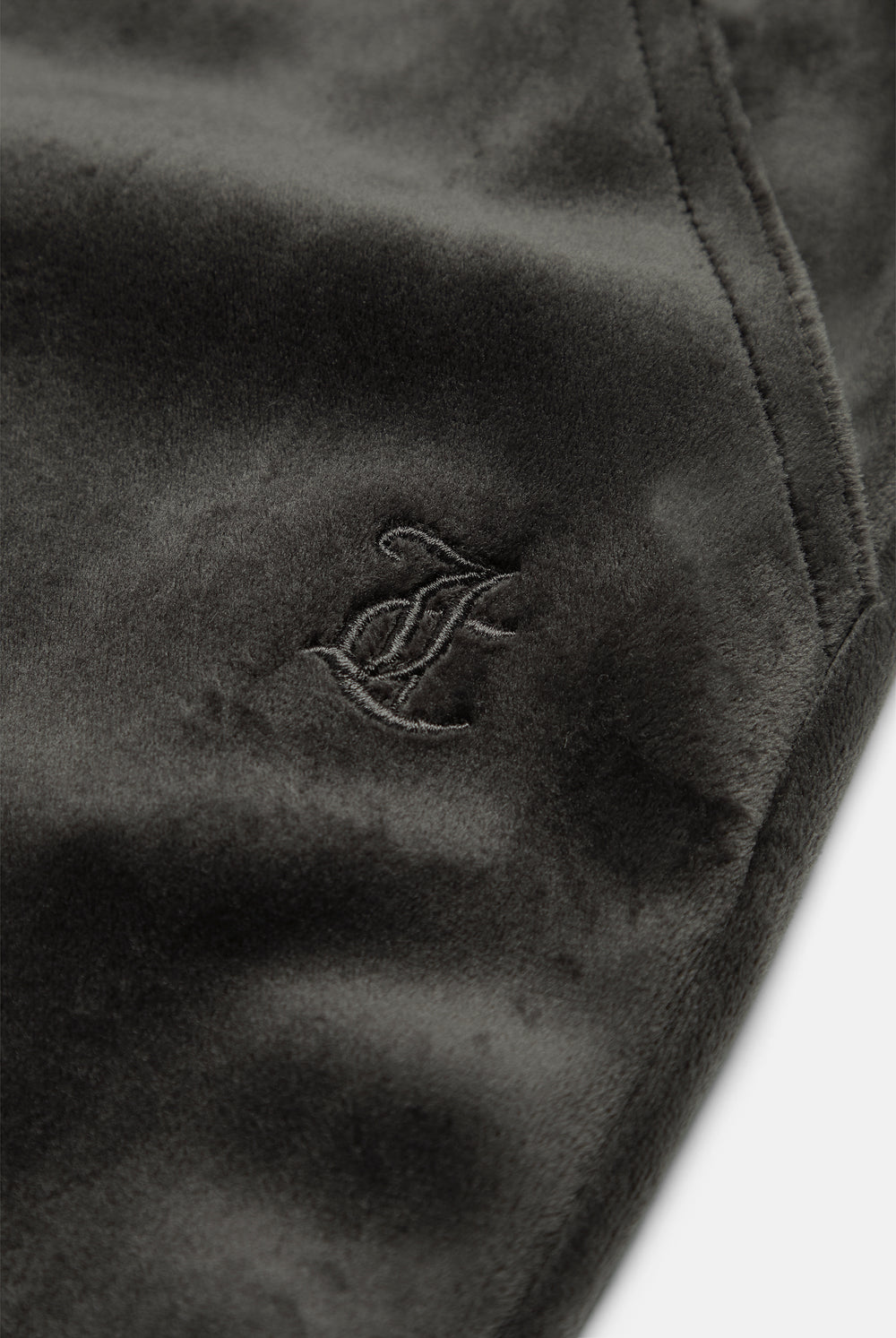 Displays the Raven 'Juicy' branded Velour Bonded Tracksuit Bottom featuring the juicy branding 