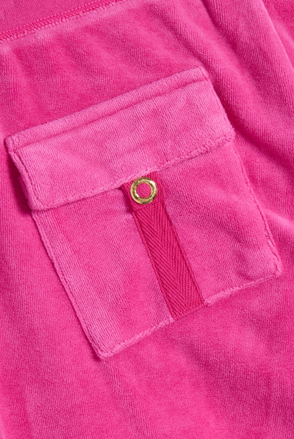 Displays the Nostalgia Pink 'Juicy' branded Washed Caisa Ultra Low Rise Pant featuring the details on the pockets 
