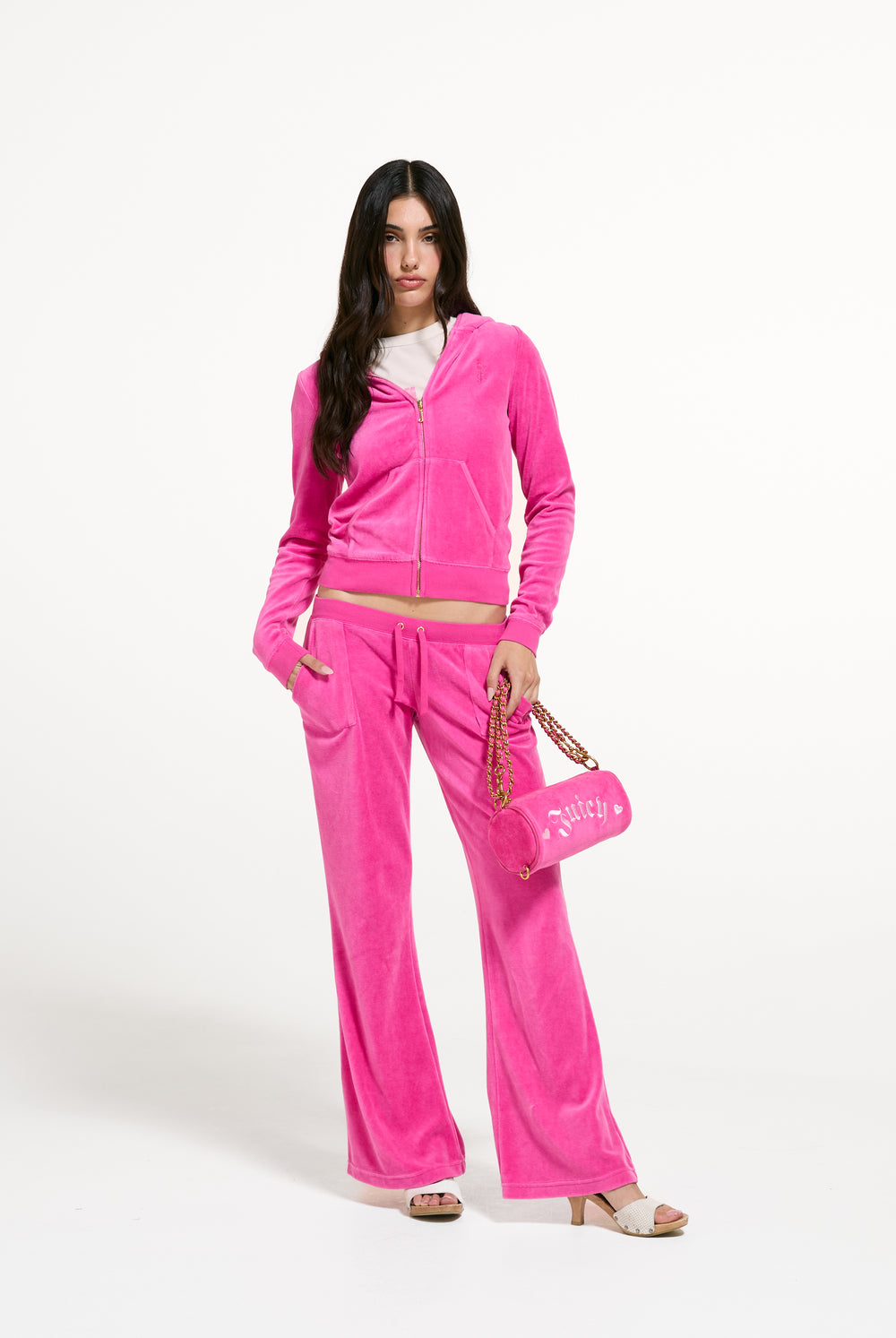 Displays a model wearing the Nostalgia Pink 'Juicy' branded Washed Robyn Hoodie