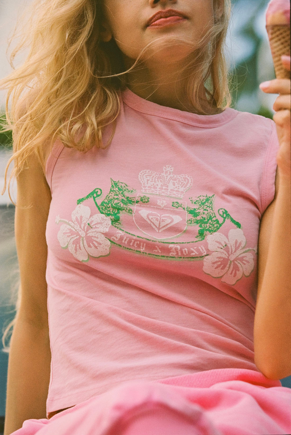 Displays a model wearing the Candy Pink Roxy & Juicy Couture crest tank top 