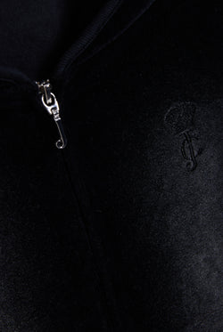 Displays the washed black cotton 'Juicy' branded velour heritage hoodie featuring the juicy logo and zip 