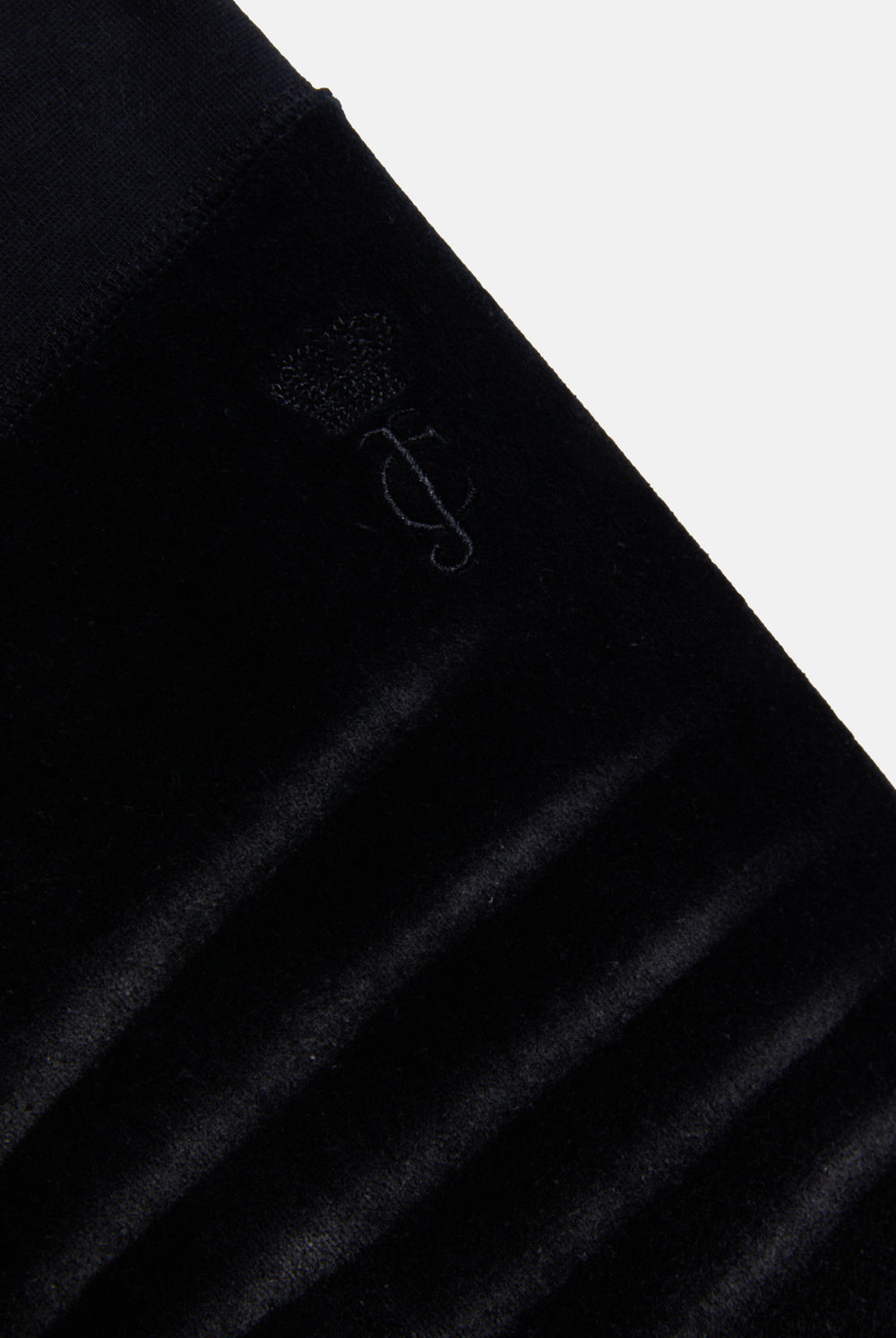 Displays he washed black cotton 'Juicy' branded velour og straight low rise pants 