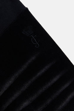 Displays he washed black cotton 'Juicy' branded velour og straight low rise pants 