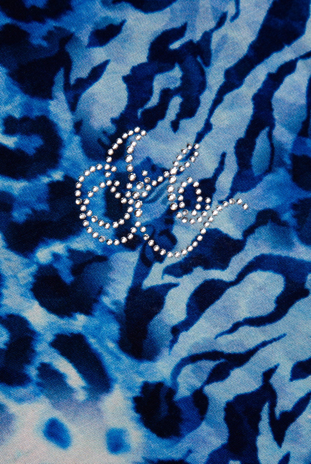 Displays the Blue Leopard print 'Juicy' branded jersey halter neck top featuring the juicy Couture logo 