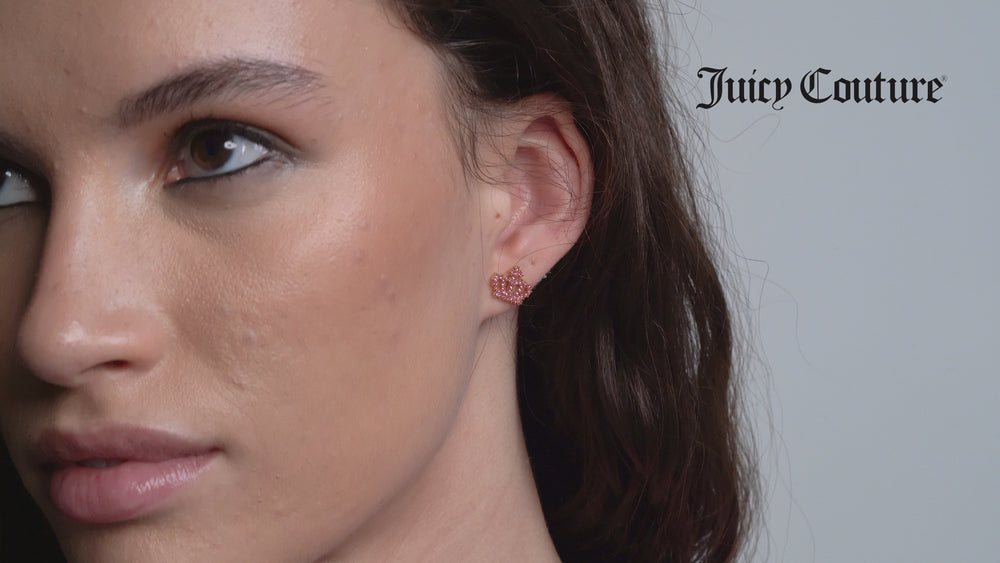Displays a model wearing the 'Juicy' Gold Tone Crystal Motif Crown Stud Earrings