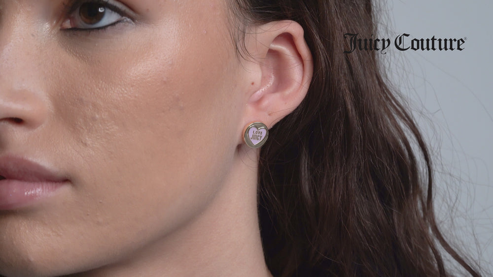 Displays a model wearing the 'Juicy' Gold Tone Love Juicy Enamel Stud Earrings